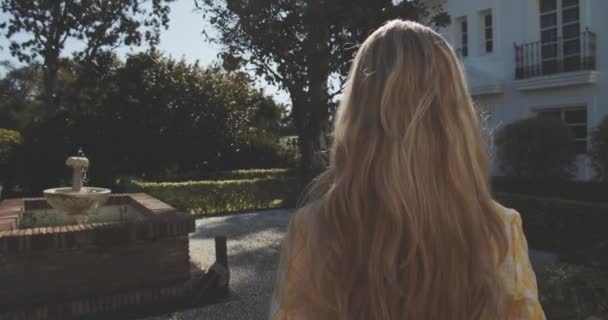 Young Woman Walking in Garden Filled with Beautifull Landscape Design — Stock Video