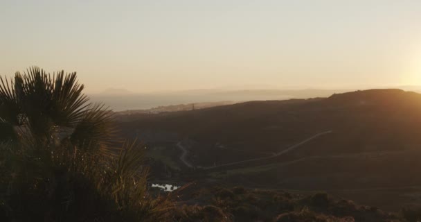 Glowing Sun Over Hill And Landscape — Stock Video