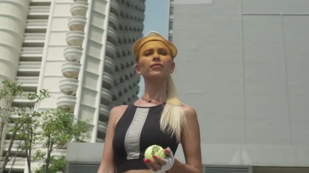 Sunny Day and Tennis Player with Blonde Hair Standing Straight — Stock Video