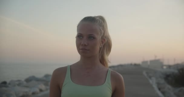 Woman Walking In Sunset Along Promenade By Sea — Vídeo de stock