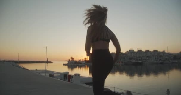 Young Athlete Jogging Along Promenade At Sunset — Vídeos de Stock