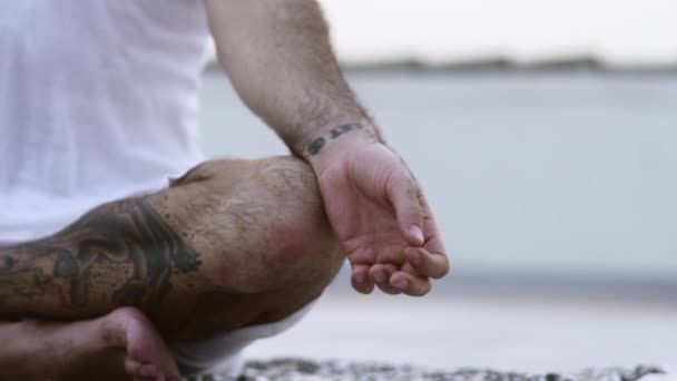 Tattooed Gentleman In White Sitting Carefree With His Legs Crossed — Stock Video