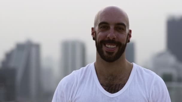 Bald Guy Smiling At The Camera And Gestures Up Doing a Peace Sign — Stock Video