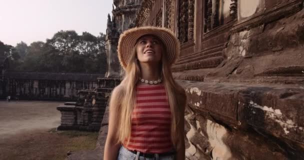 Gorgeous Female Model With the Camera Following Her Roaming in an Ancient Ruins — Stock Video