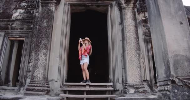 A Steady Shot of a Female Model Taking a Snap With Her Camera Phone — Stock Video