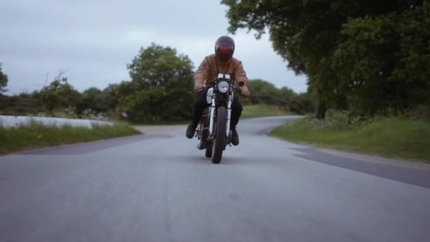 Tracking Shot of a Motorcycle Driven on a Tight Road on a Clear Skies — Stock video