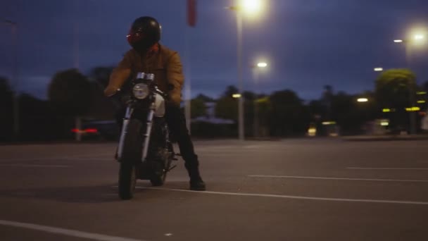 Breathtaking Drone Shot of a Motorcycle on a Parking Spot Under the Night Skies — Stockvideo