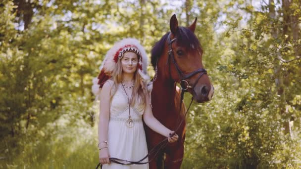 Woman In Headdress With Horse In Forest — Stok Video