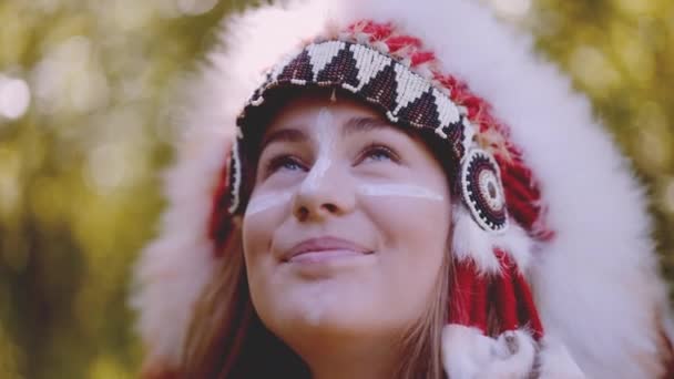 Woman In Headdress Smiling And Looking Up At Horse — Stockvideo