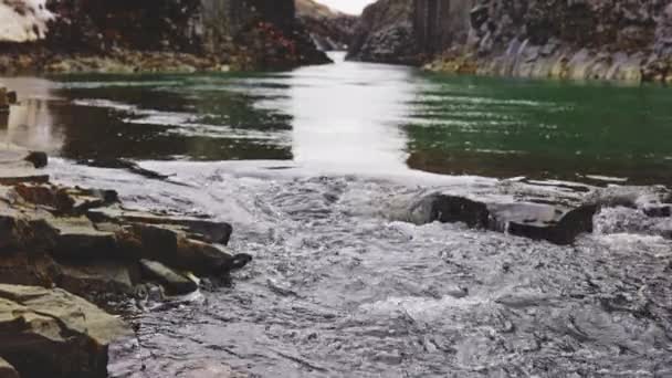 Gushing Water On the Defocused Background of the Studlagil Canyon — Stock Video