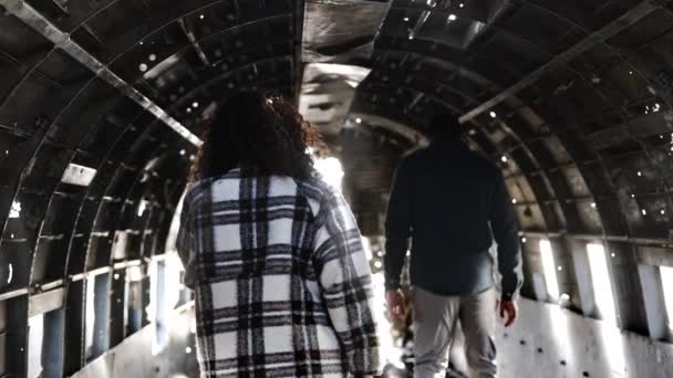 Shot of Tourists Looking the Inside the Solheimasandur Plane Wreck in Iceland — Stock video