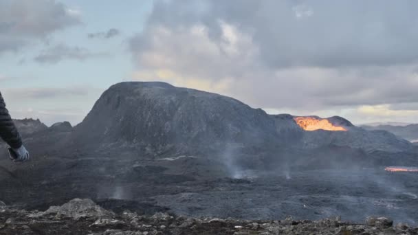 Man Walking Towards Lava Flow From Erupting Fagradalsfjall Volcano In Iceland — Stock video