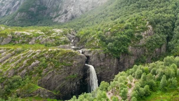 Drone Over Waterfall Cascading Into Forest Valley — Vídeos de Stock