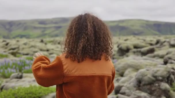 Woman Taking Photograph In Mossy Landscape — Stock Video