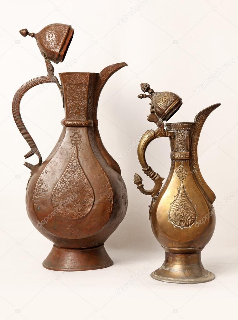 Two old wine jug on a white background
