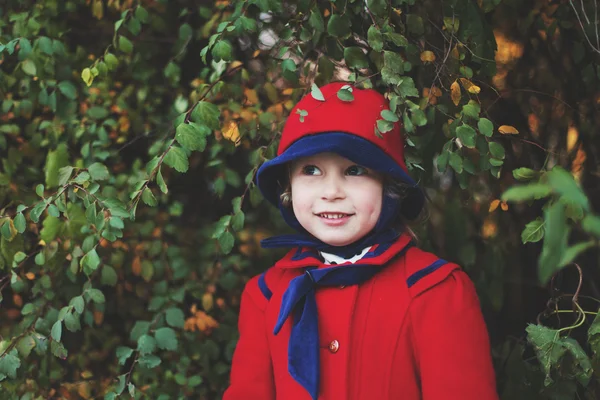 Little girl in red hat and coat — Stock Photo, Image