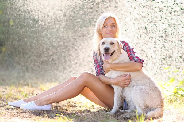 Portrait of a beautiful girl with a dog — Stock Photo, Image