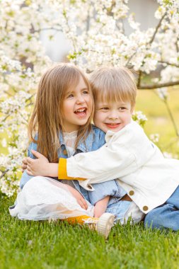 portrait of two children in the spring in nature