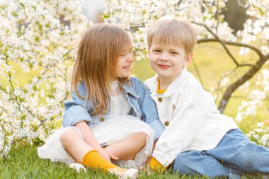portrait of two children in the spring in nature