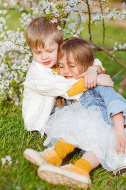 portrait of two children in the spring in nature
