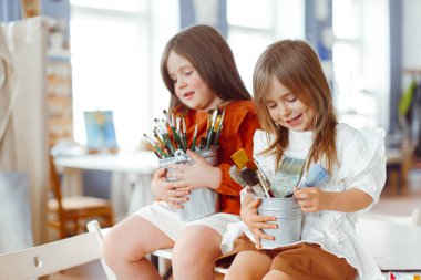 portrait of two girls sisters in studio