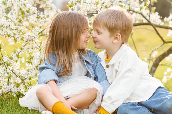 portrait of two children in the spring in nature