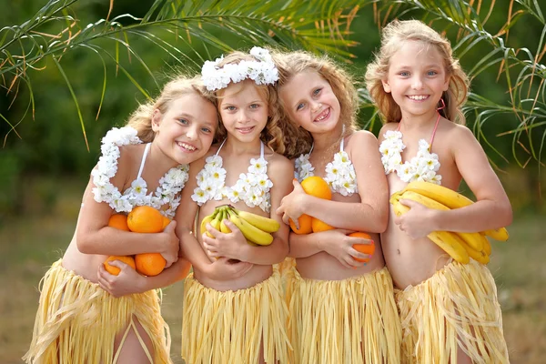 Portrait of four girls in a tropical style — Stock Photo, Image