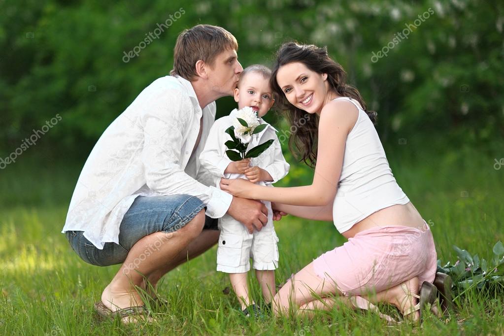 Portrait of a happy mother, dad and baby