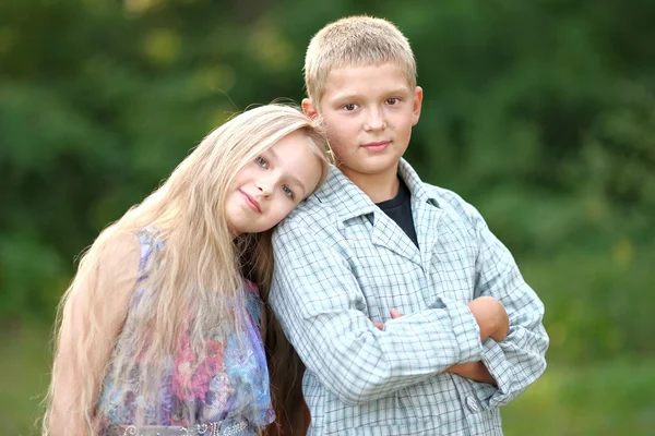 Portrait of a boy and girl in summer — Stock Photo, Image