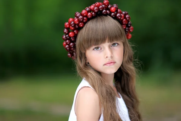 Portrait of little girl with a wreath of cherry — Stock Photo, Image