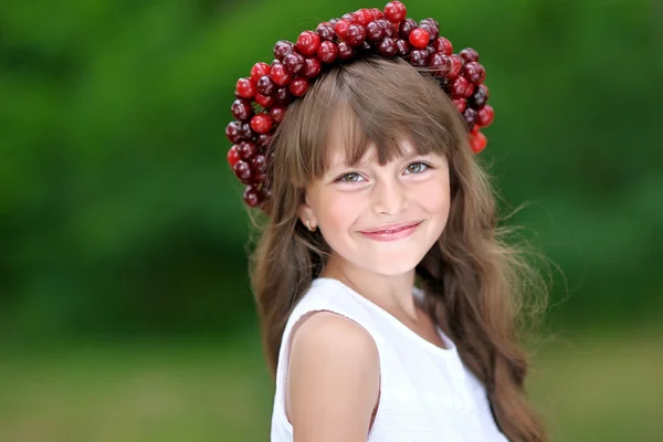 Portrait of little girl with a wreath of cherry — Stock Photo, Image