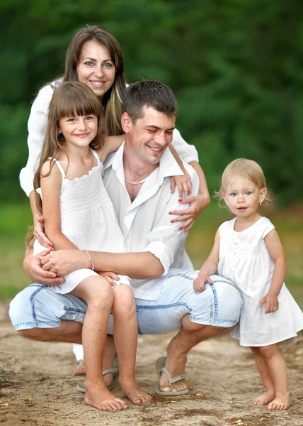 Portrait of a happy family in summer nature — Stock Photo, Image