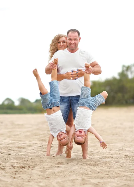 Portrait of a happy family in summer nature — Stock Photo, Image