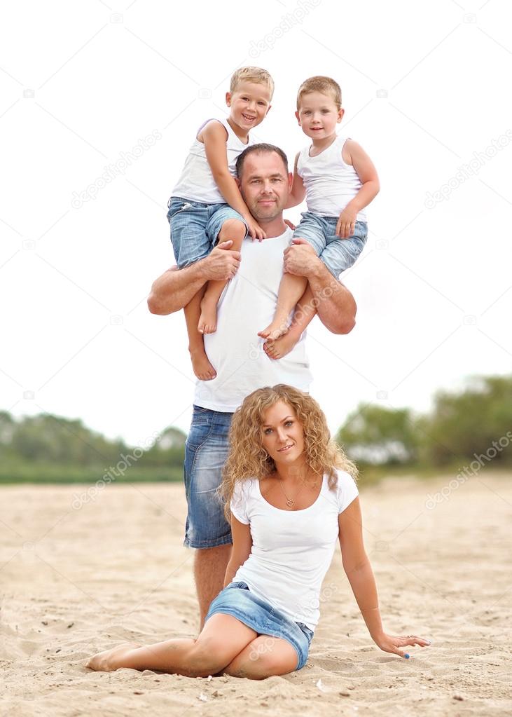 portrait of a happy family in summer nature
