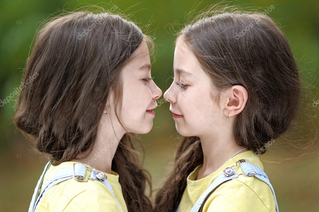 Portrait of two little girls twins Stock Photo by ©zagorodnaya 57448523