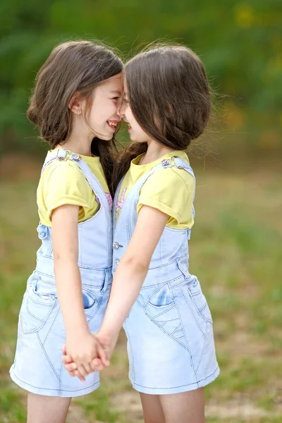 Portrait of two little girls twins Stock Picture