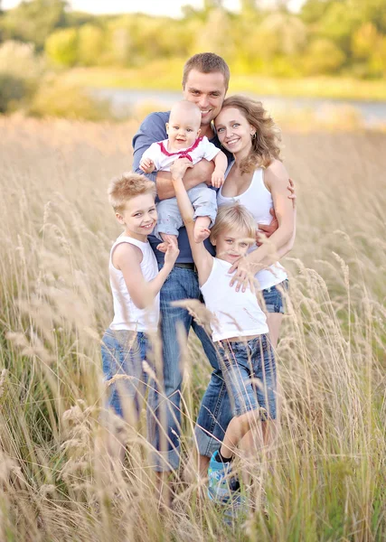 Portrait of happy family relaxing in nature summer — Stock Photo, Image