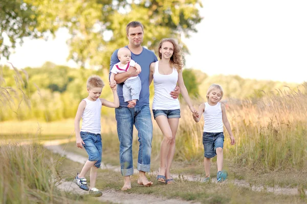 Portrait of happy family relaxing in nature summer — Stock Photo, Image