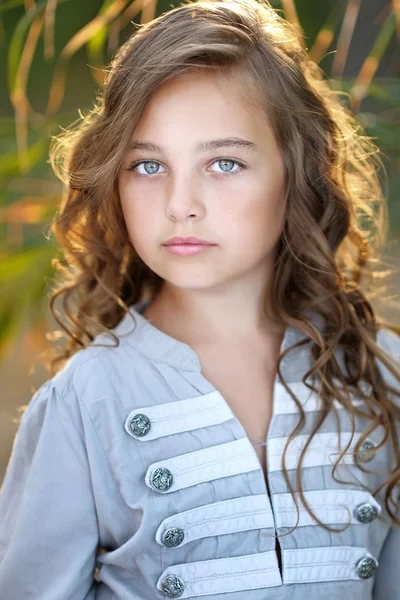 Portrait of little girl in tropical style — Stock Photo, Image