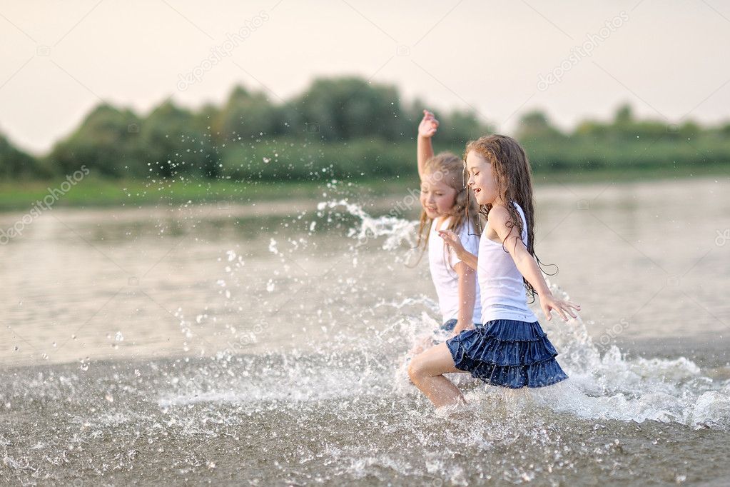 Portrait of children on the beach in summer