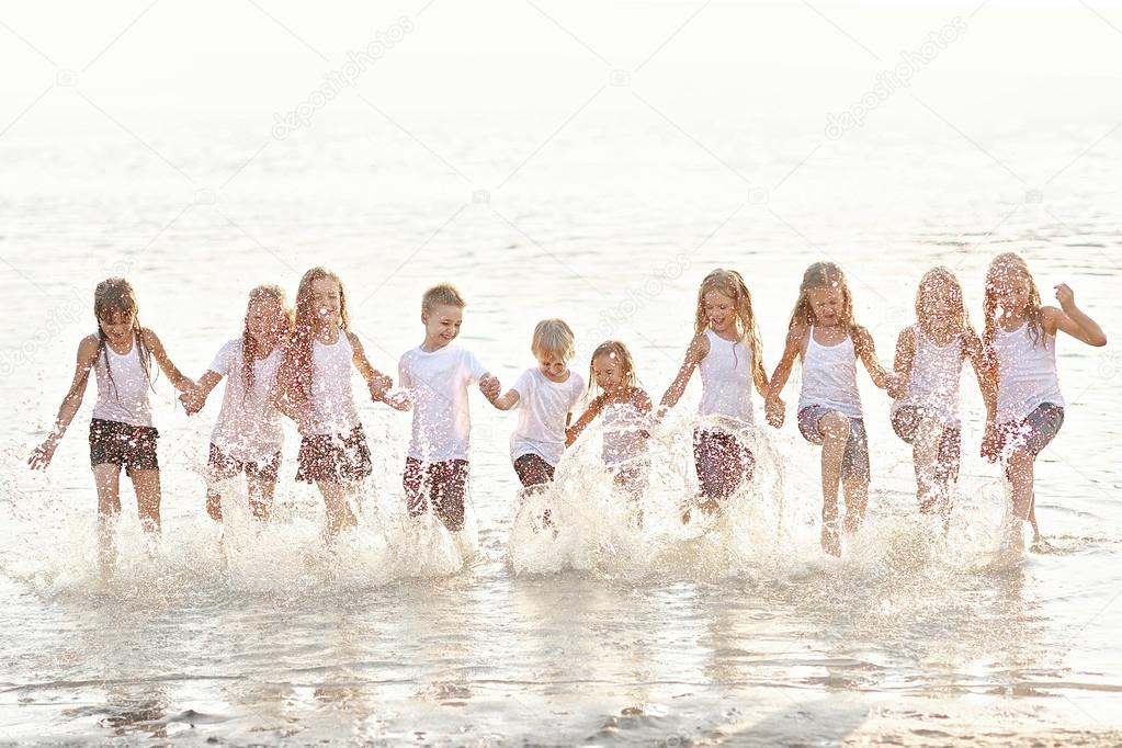 Portrait of children on the beach in summer