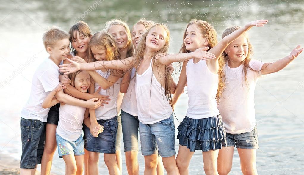 Portrait of children on the beach in summer