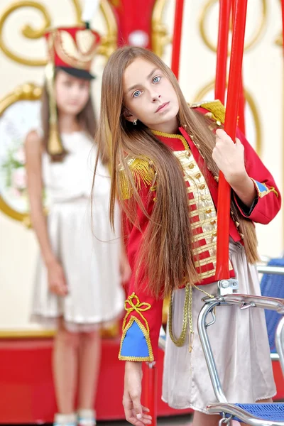 Portrait of two girls in the style of hussars — Stock Photo, Image