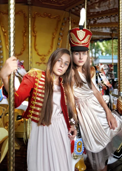 Portrait of two girls in the style of hussars — Stock Photo, Image