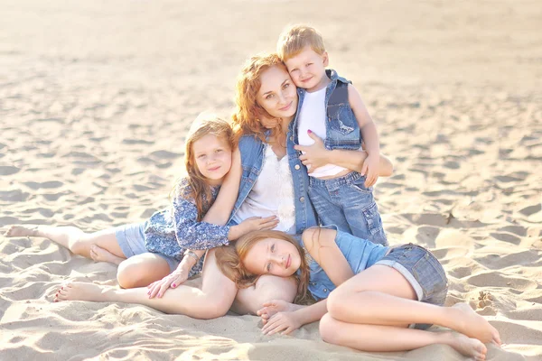 Family portrait of mother and of a boy and his two sisters loved — Stock Photo, Image