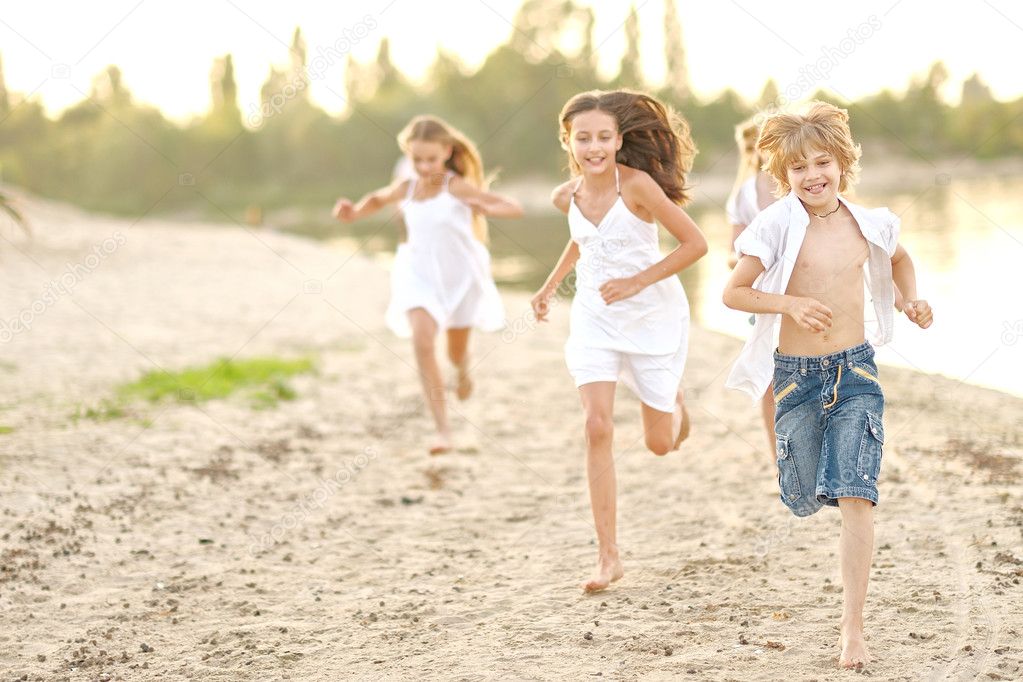 Portrait of children on the beach in summer