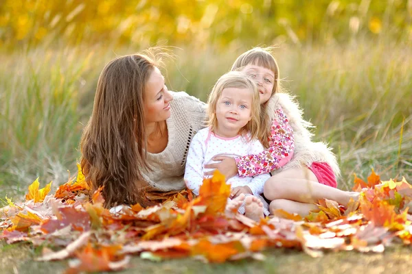 Portrait of a beautiful family in autumn — Stock Photo, Image