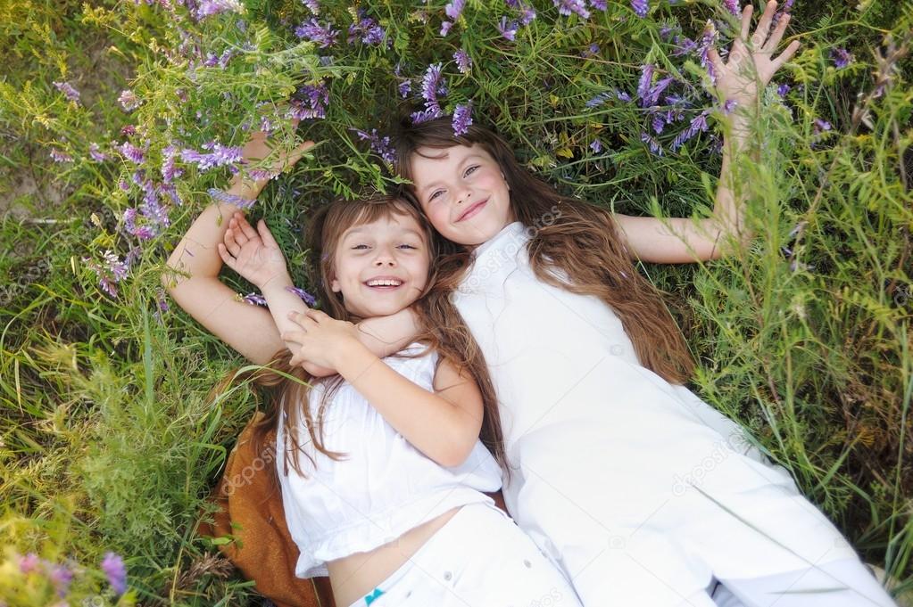 Portrait of two girls in the woods girlfriends