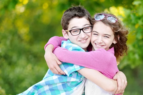 Portrait of a boy and girl in summer — Stock Photo, Image