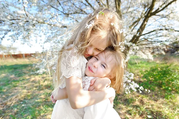 Portrait of two little girls girlfriends spring — Stock Photo, Image